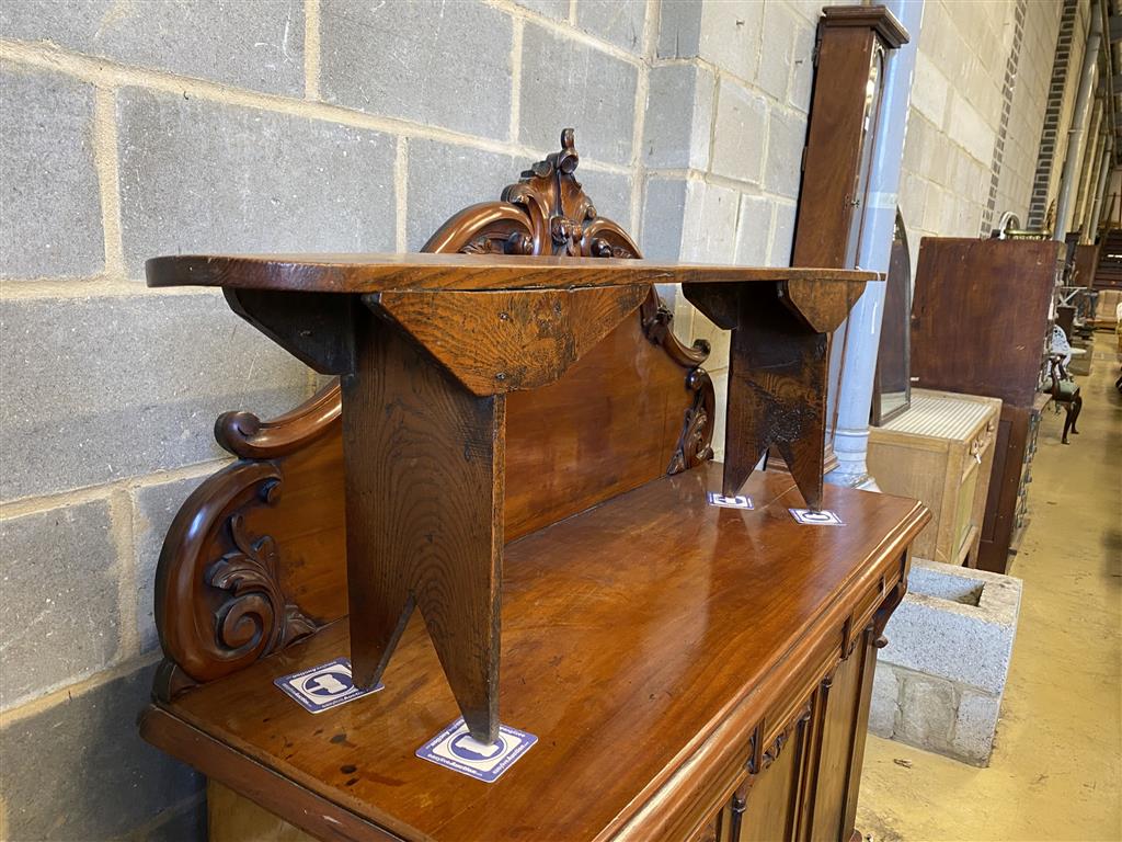 An 18th century elm bench seat, length 183cm, height 49cm